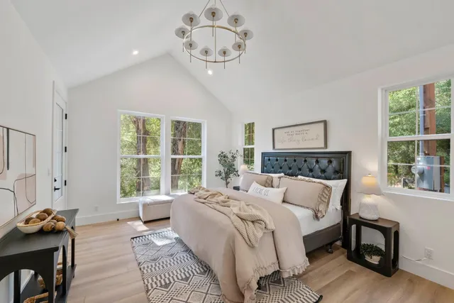 a bed room with a bed and a window