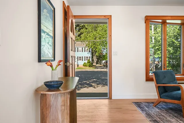 a living room with furniture fireplace and flat screen tv