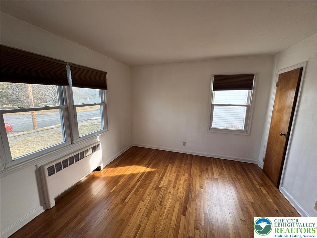 3003 Cornwall Road Bethlehem, PA 18017 - Photo 13 of 43 a view of an empty room with wooden floor and a window