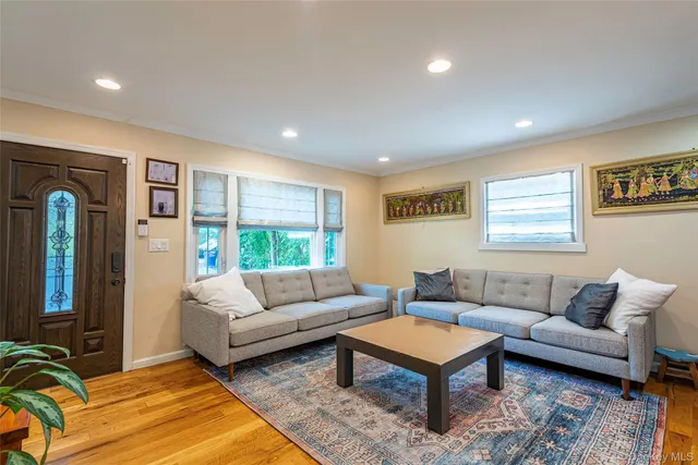 a living room with furniture and a rug