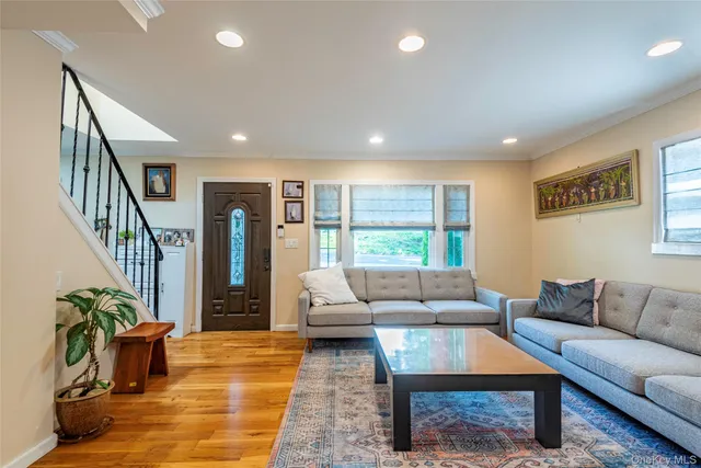 a living room with furniture and a rug