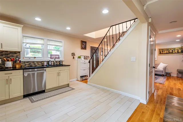 a kitchen with sink and cabinets