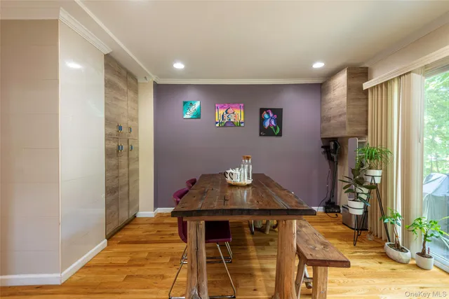 a view of a dining room with furniture and a window
