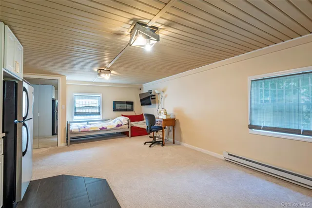 a kitchen with refrigerator and window
