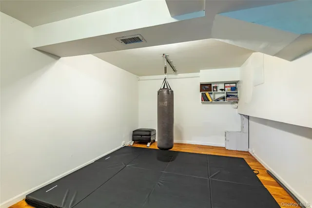 a bathroom with a window a sink and a mirror