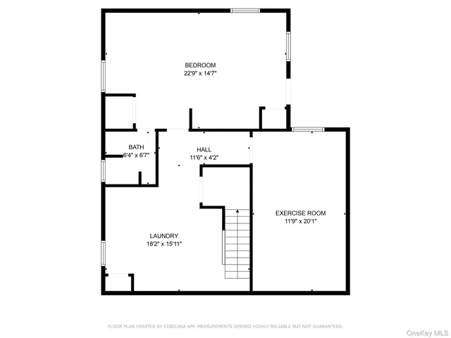 a picture of a bench in front of a wall