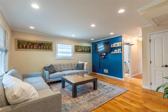 a living room with furniture rug and window