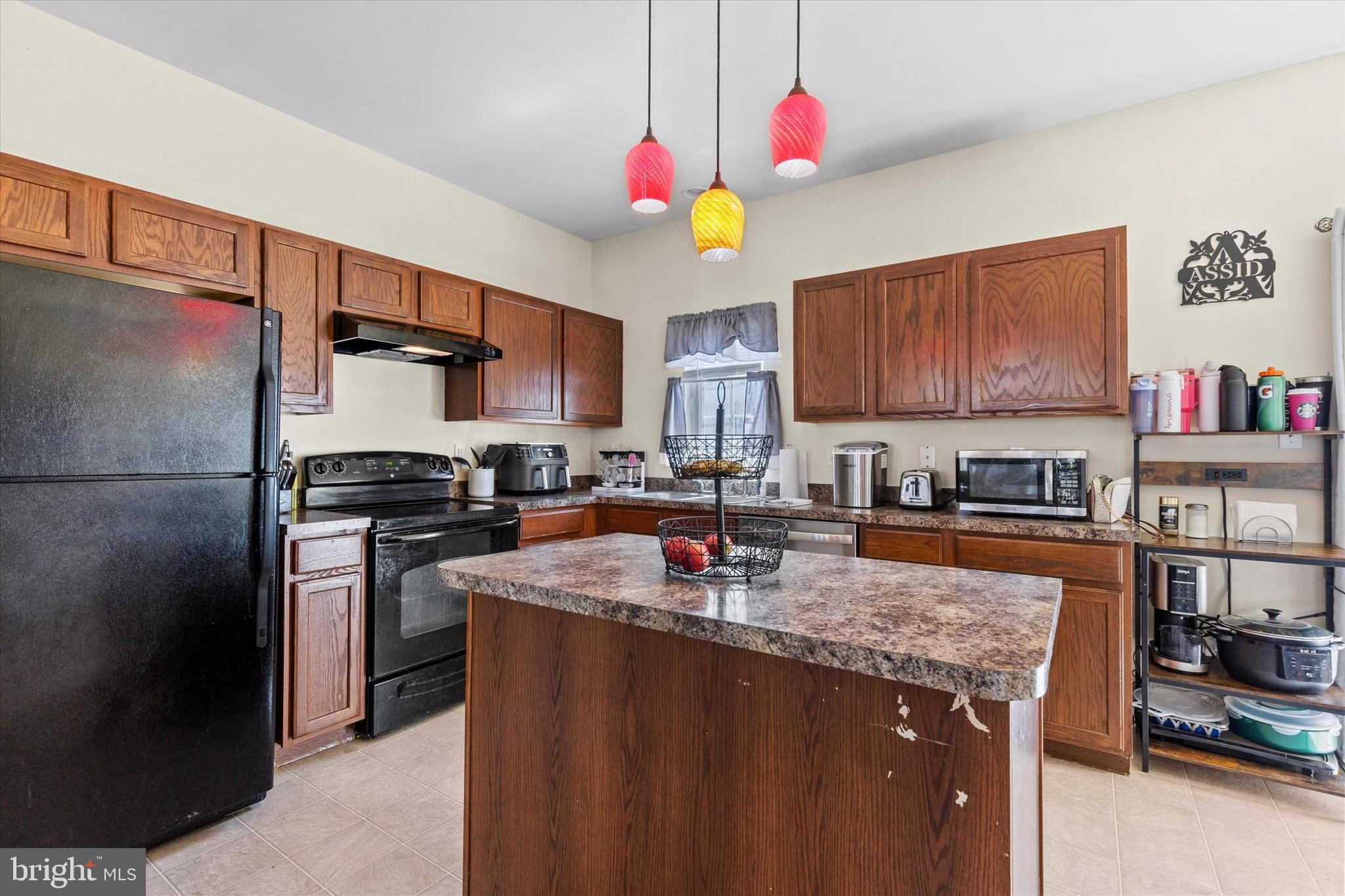 4113 Trabert Court Dover, PA 17315 - Photo 11 of 28 a kitchen with stainless steel appliances granite countertop a refrigerator stove and sink