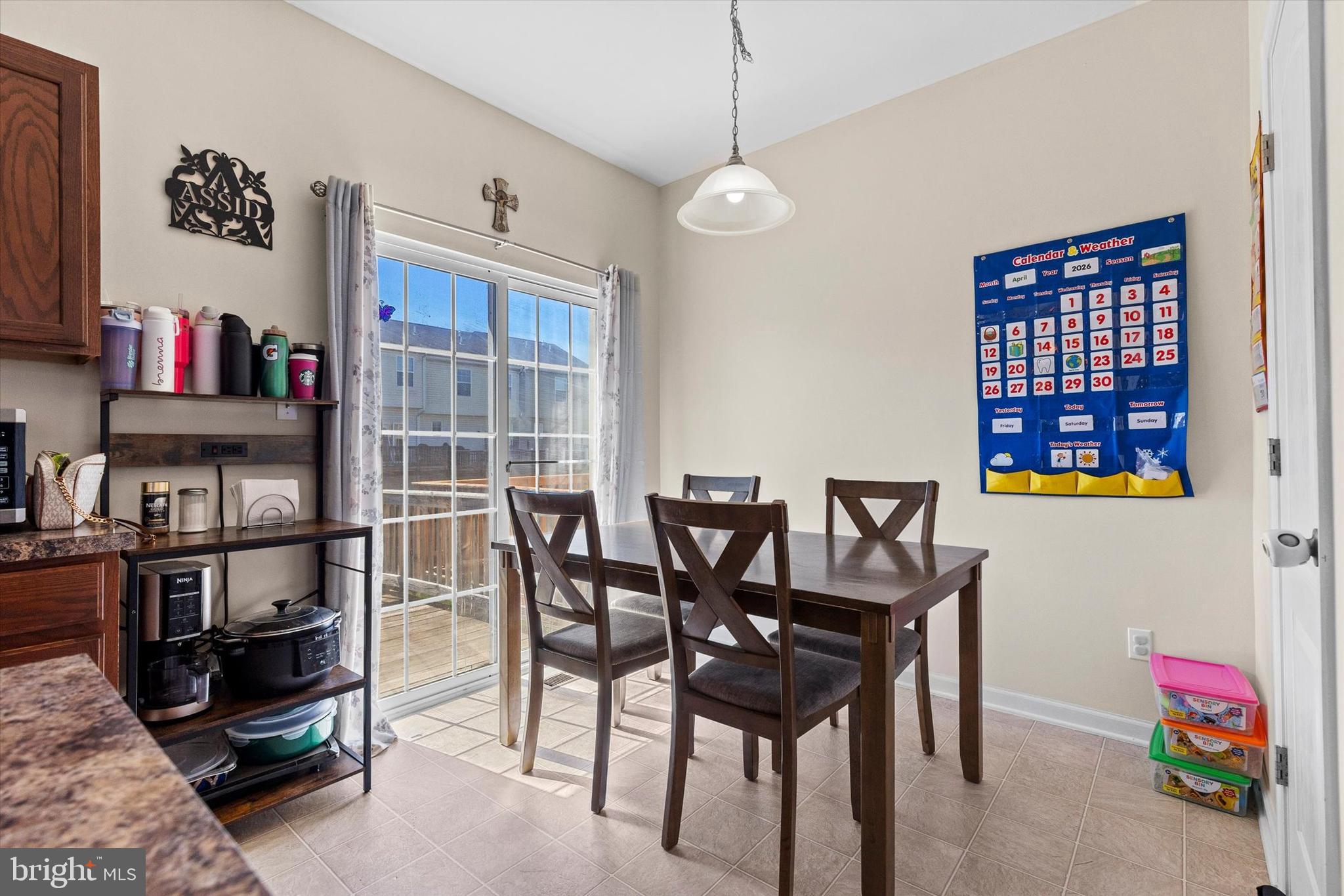 4113 Trabert Court Dover, PA 17315 - Photo 13 of 28 a view of a dining room with furniture and a book shelf