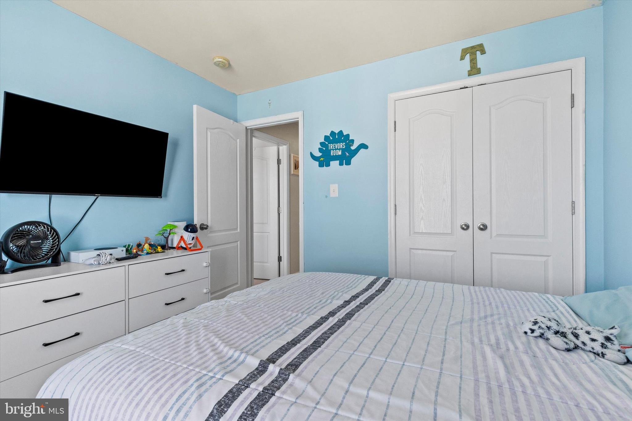 4113 Trabert Court Dover, PA 17315 - Photo 21 of 28 a bedroom with a bed and a flat screen tv