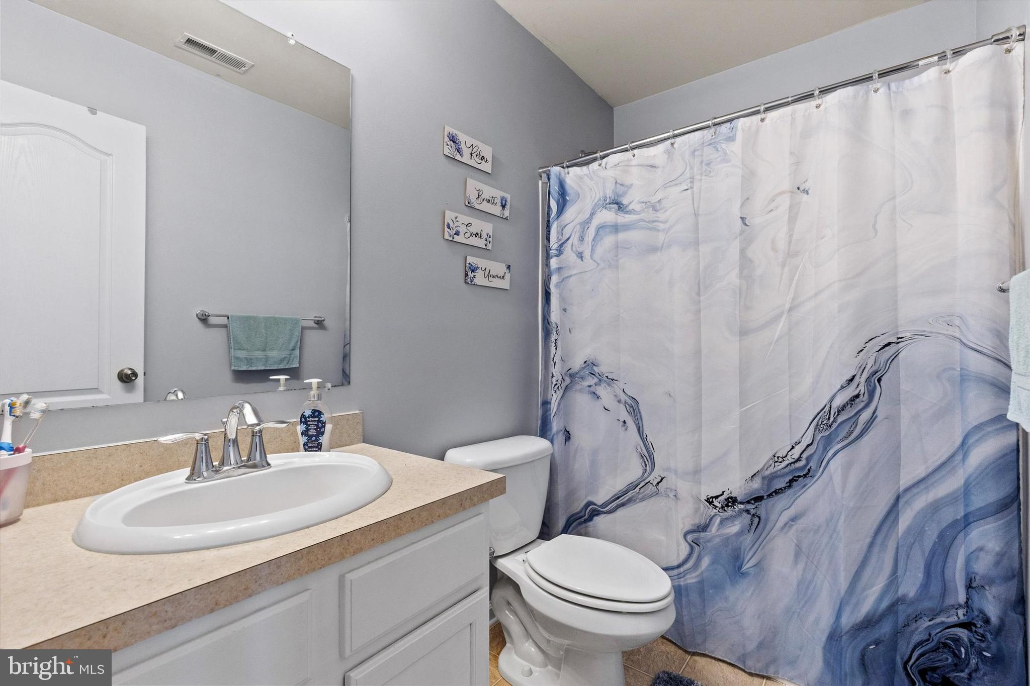 4113 Trabert Court Dover, PA 17315 - Photo 23 of 28 a bathroom with a sink toilet and shower