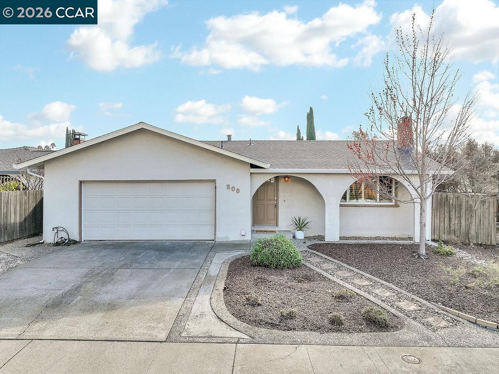 508 Viewmont Street Benicia, CA 94510 - Photo 1 of 34 a front view of a house with a yard and garage