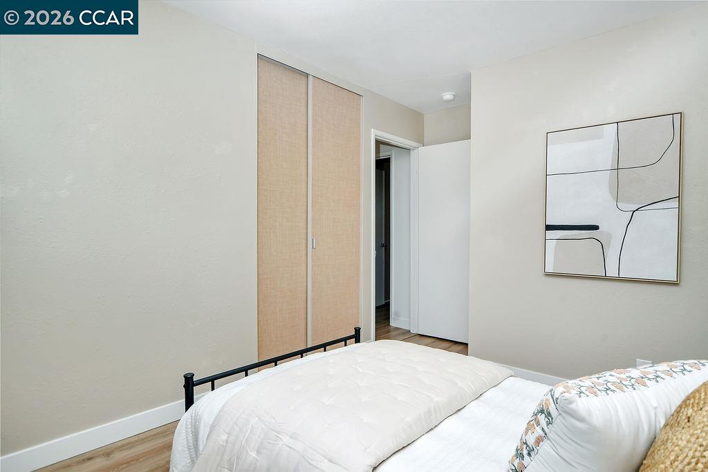 508 Viewmont Street Benicia, CA 94510 - Photo 18 of 34 a bedroom with a bed and a painting on the wall