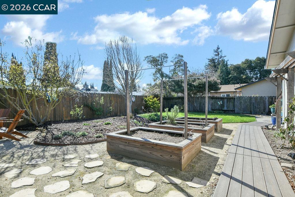 508 Viewmont Street Benicia, CA 94510 - Photo 28 of 34 a view of a backyard with couches plants and wooden fence