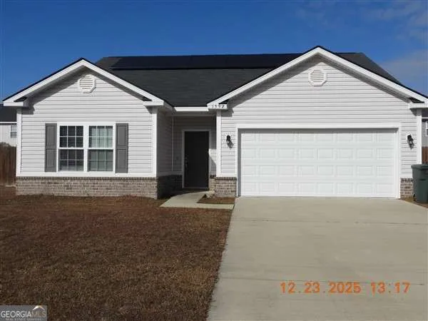 a front view of a house with garage