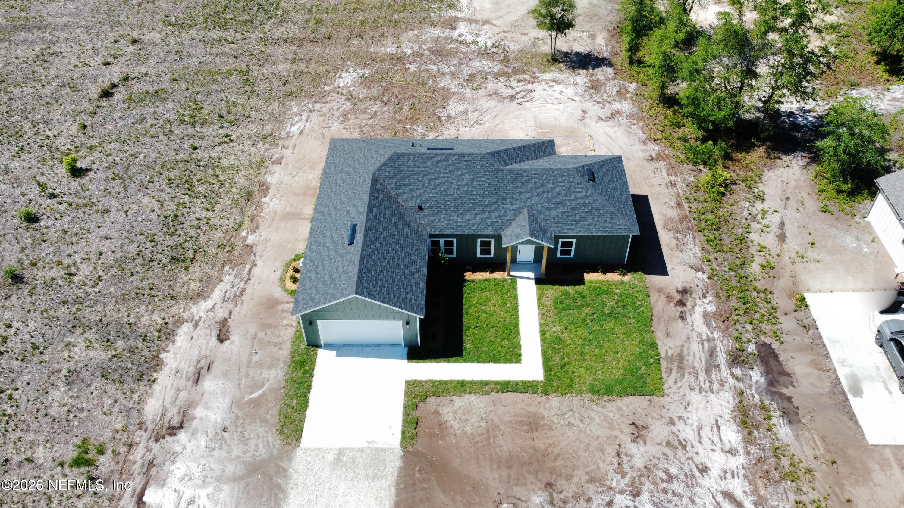 261121 Rowe Road Hilliard, FL 32046 - Photo 31 of 33 a front view of a house with a yard