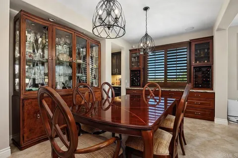 a kitchen with stainless steel appliances granite countertop a stove refrigerator and cabinets