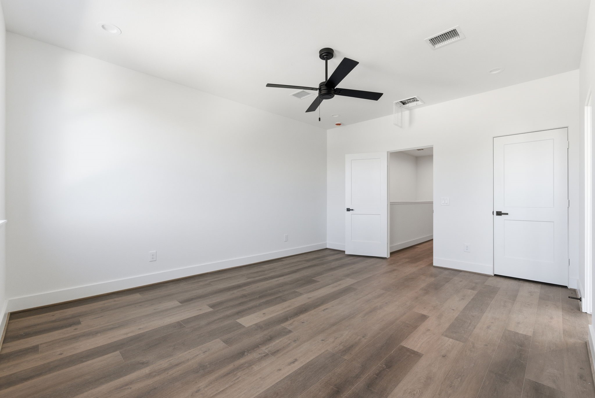 7706 Earl Rudder Way Houston, TX 77055 - Photo 30 of 46 a view of empty room with wooden floor