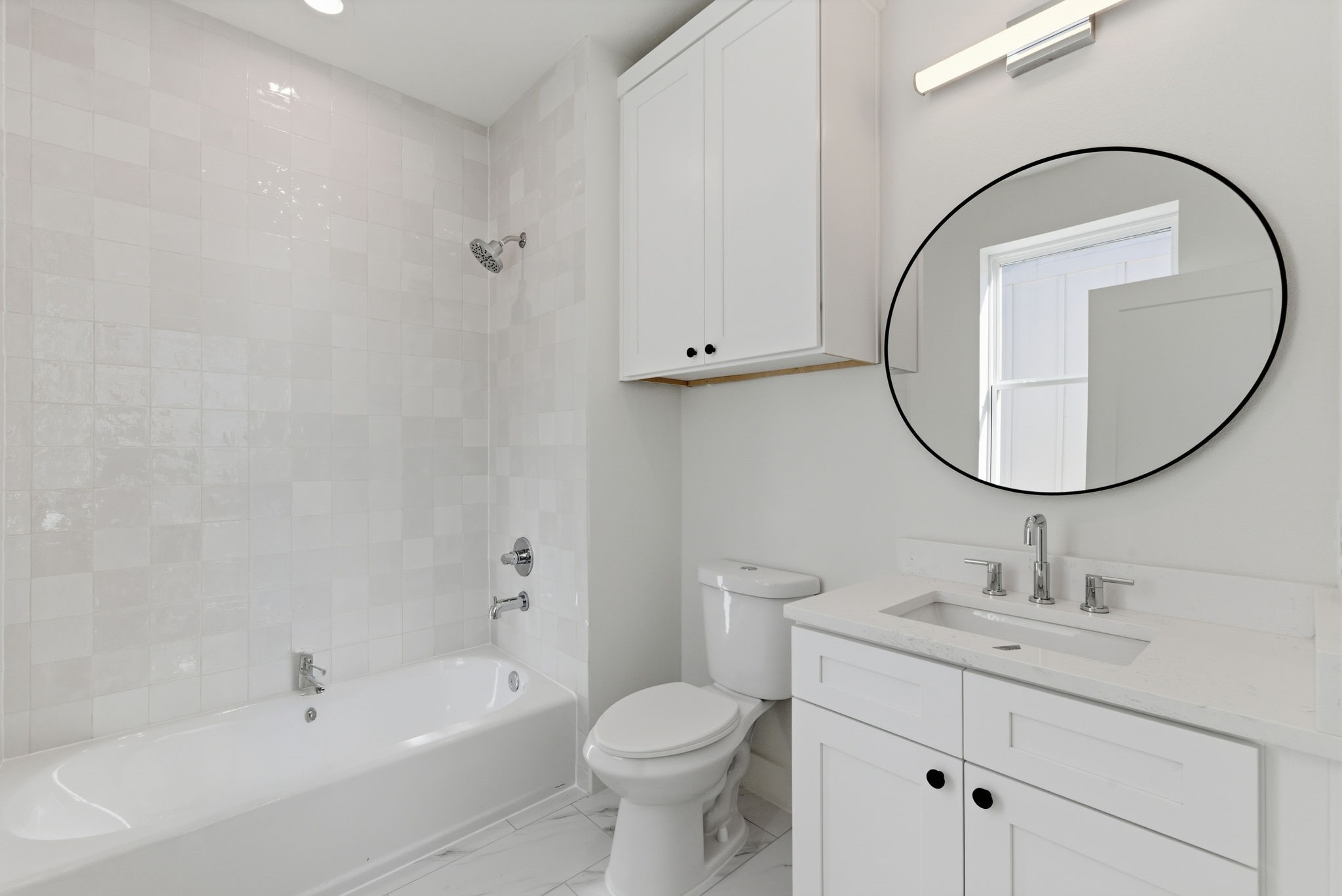 7706 Earl Rudder Way Houston, TX 77055 - Photo 38 of 46 a bathroom with a sink a toilet and a mirror