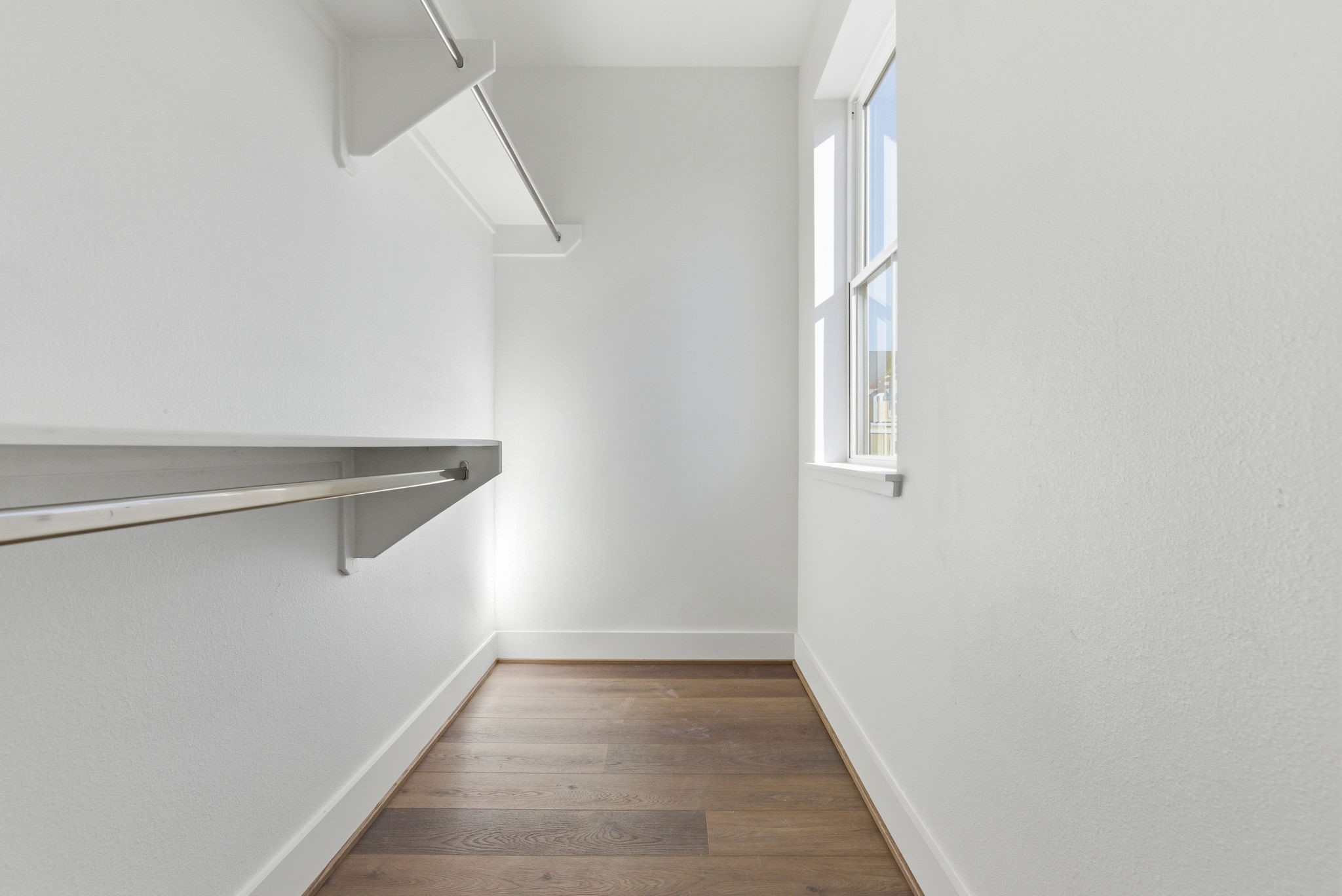 7706 Earl Rudder Way Houston, TX 77055 - Photo 39 of 46 a view of an empty room with wooden floor and a window