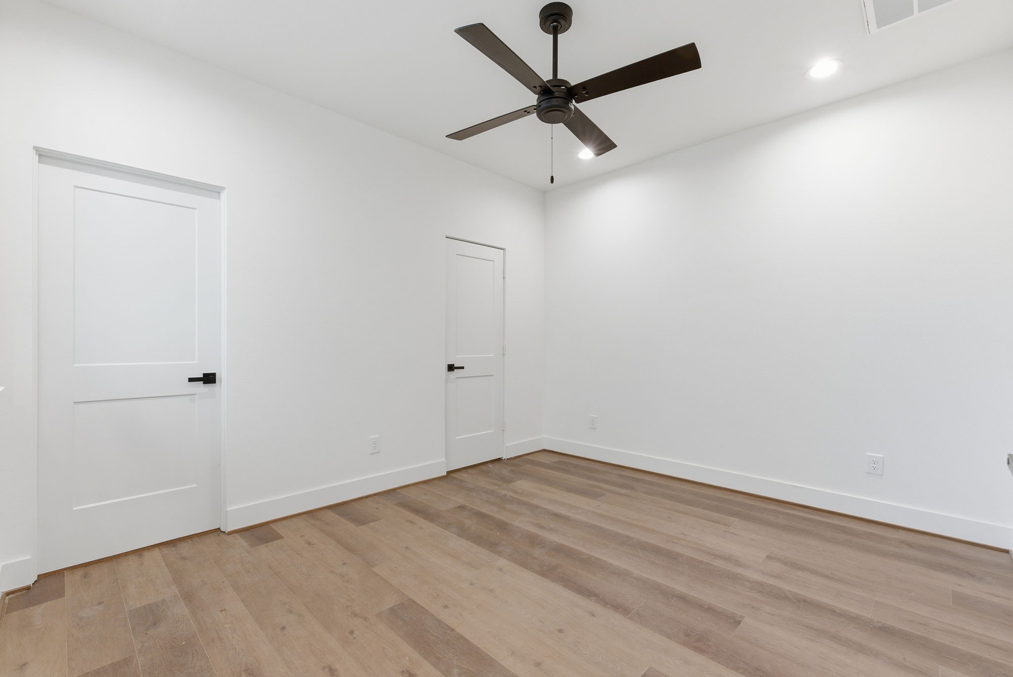 7706 Earl Rudder Way Houston, TX 77055 - Photo 10 of 46 an empty room with a window and a fan