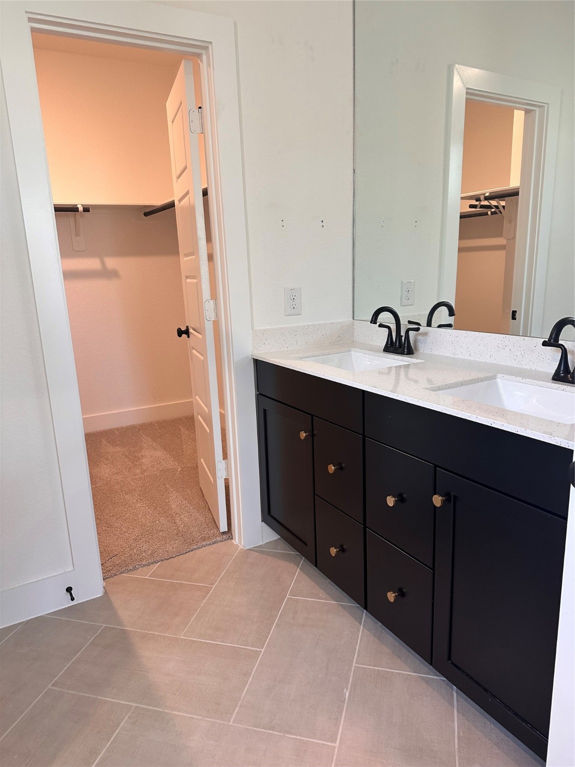 5115 Getty Lane Iowa Colony, TX 77578 - Photo 6 of 29 a spacious bathroom with a double vanity sink and mirror