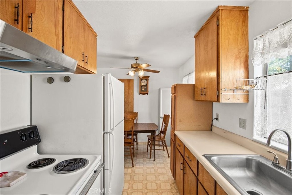 1602 Davis Street Chico, CA 95928 - Photo 10 of 24 a kitchen with a sink a stove and a refrigerator
