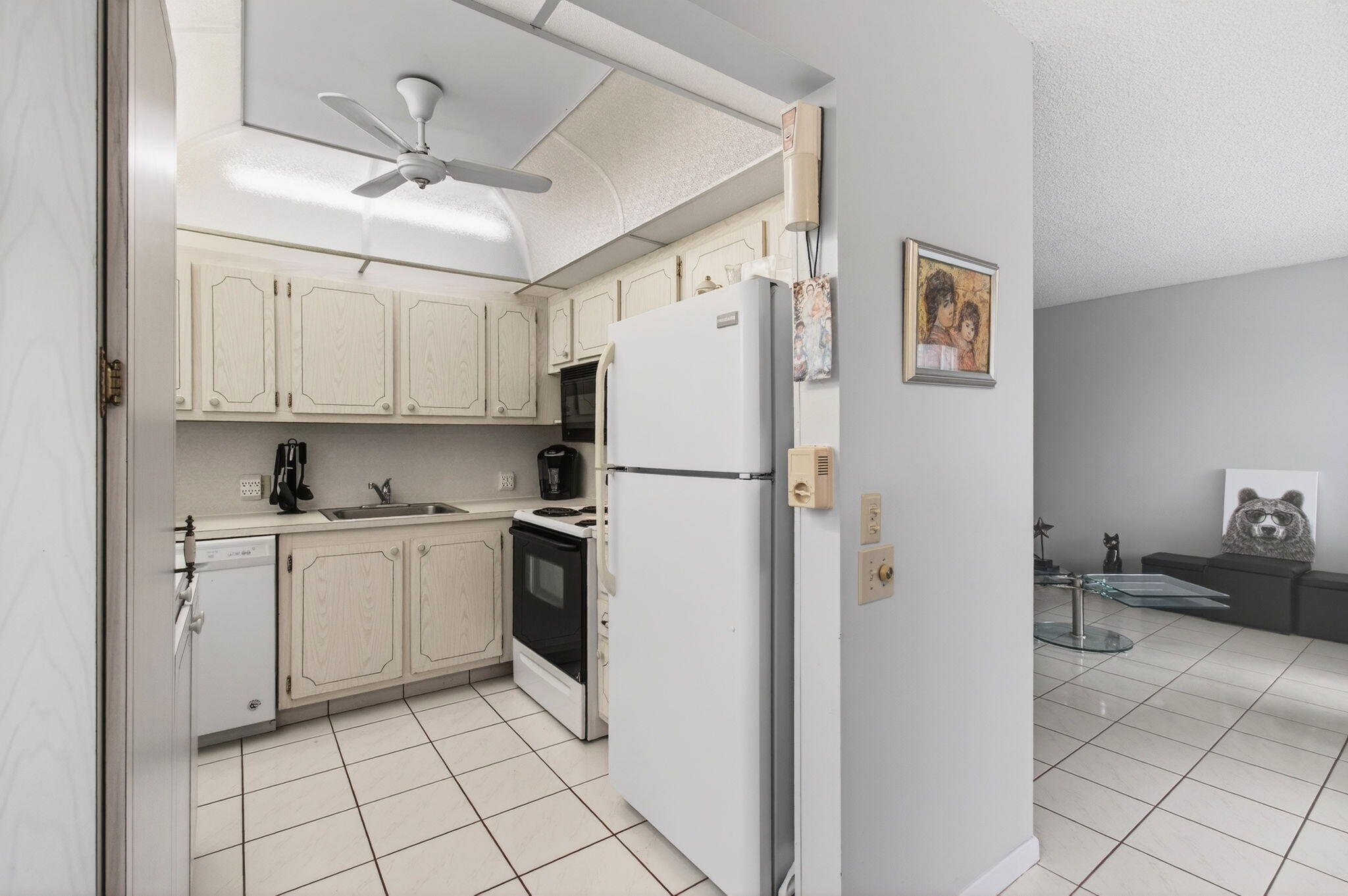 281 Dorset G Boca Raton, FL 33434 - Photo 13 of 85 a kitchen with stainless steel appliances a refrigerator sink and cabinets