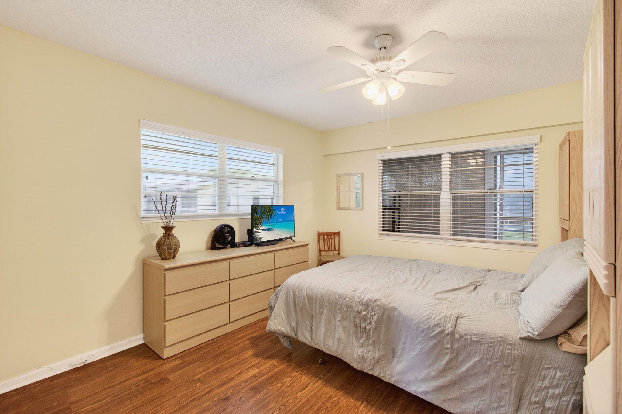 281 Dorset G Boca Raton, FL 33434 - Photo 20 of 85 a bedroom with a bed and window