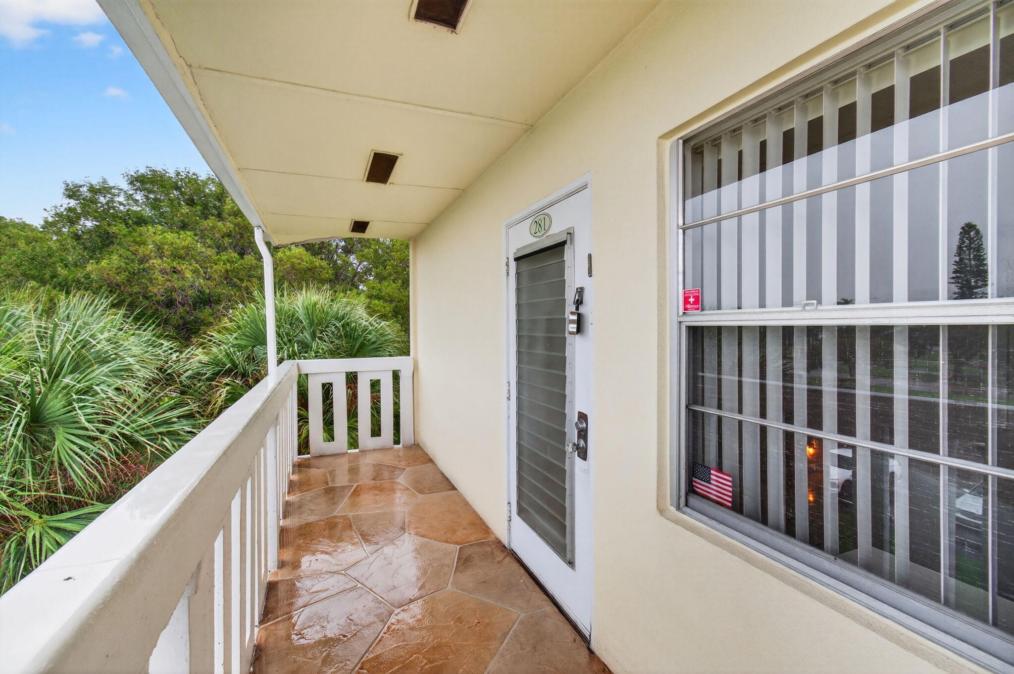 281 Dorset G Boca Raton, FL 33434 - Photo 2 of 85 a view of balcony with wooden floor and fence