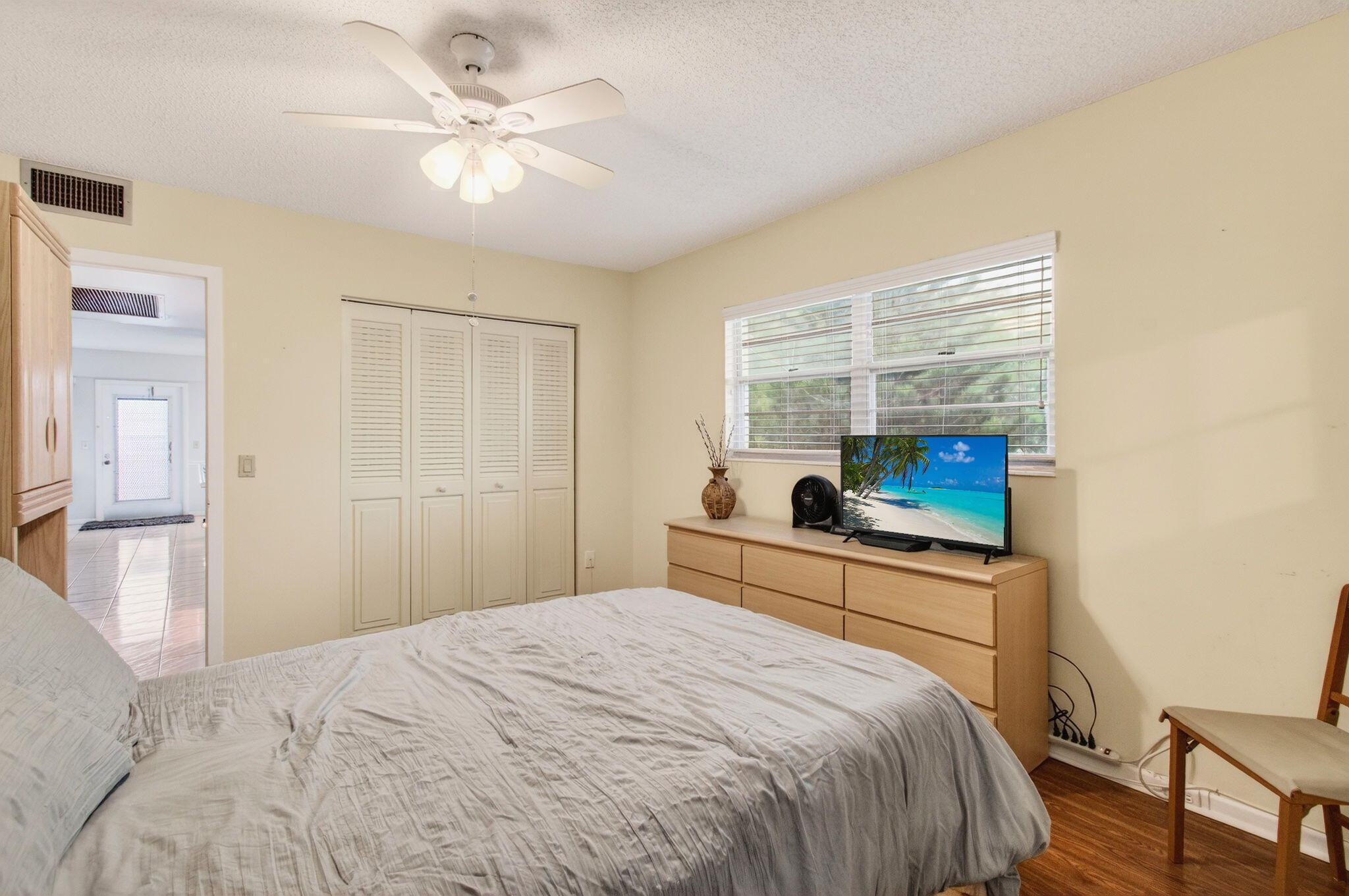 281 Dorset G Boca Raton, FL 33434 - Photo 23 of 85 a bedroom with a bed and a window