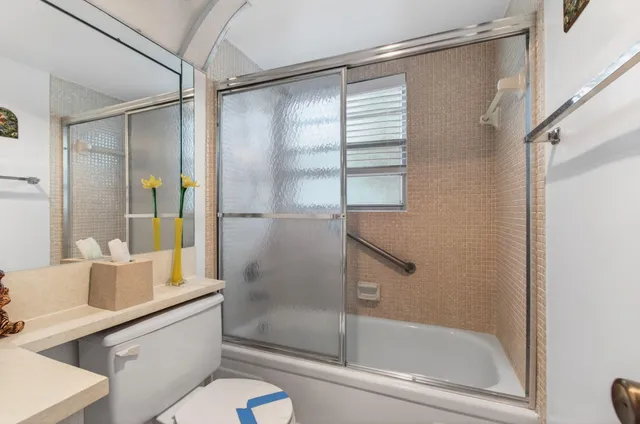 a bed room with a bed and a tv