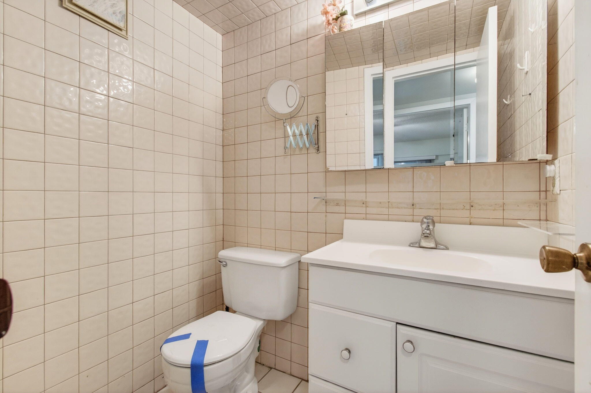 281 Dorset G Boca Raton, FL 33434 - Photo 27 of 85 a bathroom with a sink a toilet and a mirror