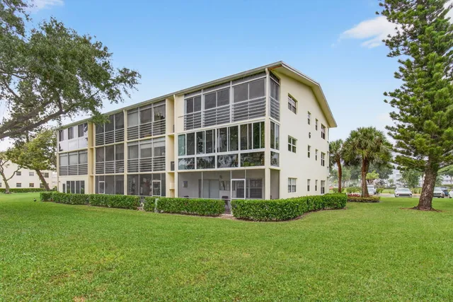 a lobby with furniture and a large window