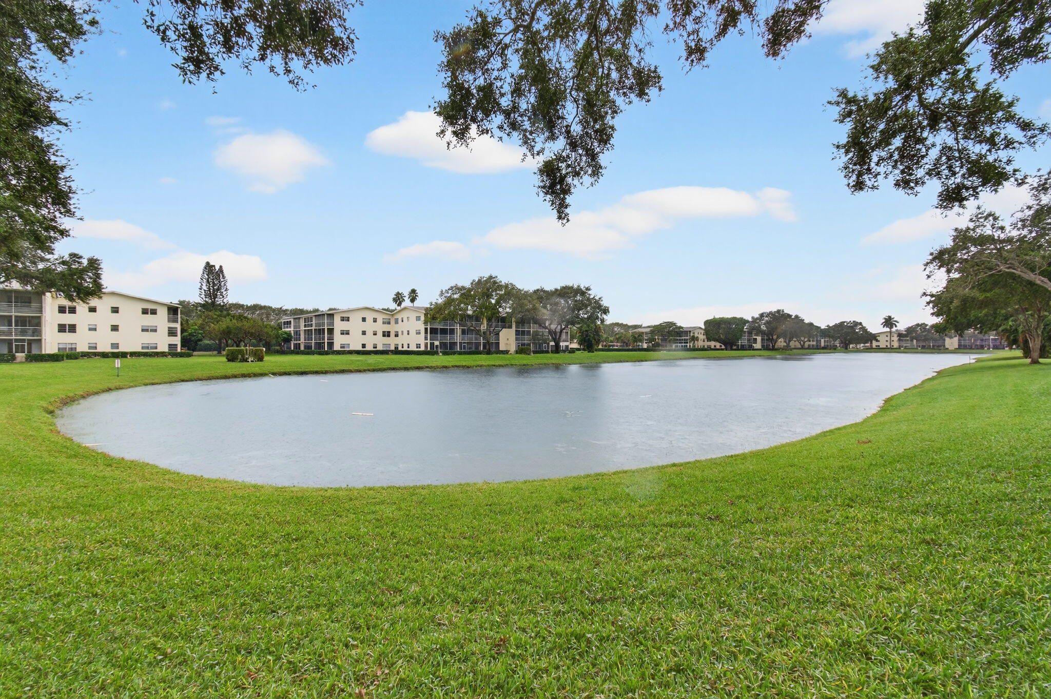 281 Dorset G Boca Raton, FL 33434 - Photo 45 of 85 a view of a lake with houses in the back