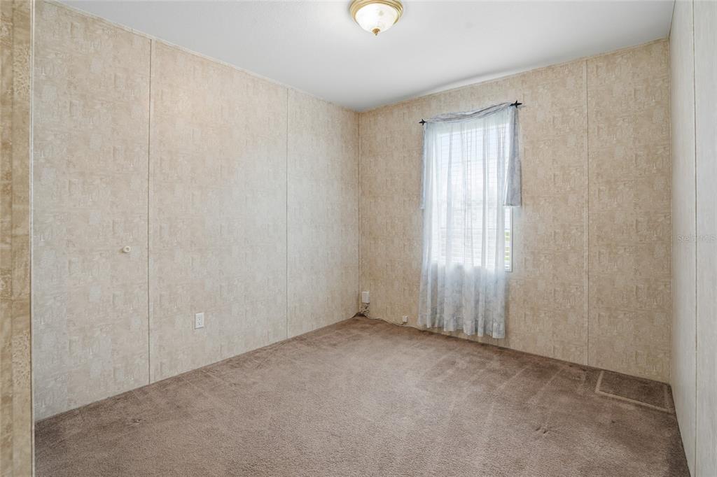 11305 Broadview Road Seffner, FL 33584 - Photo 23 of 34 a view of an empty room with a window