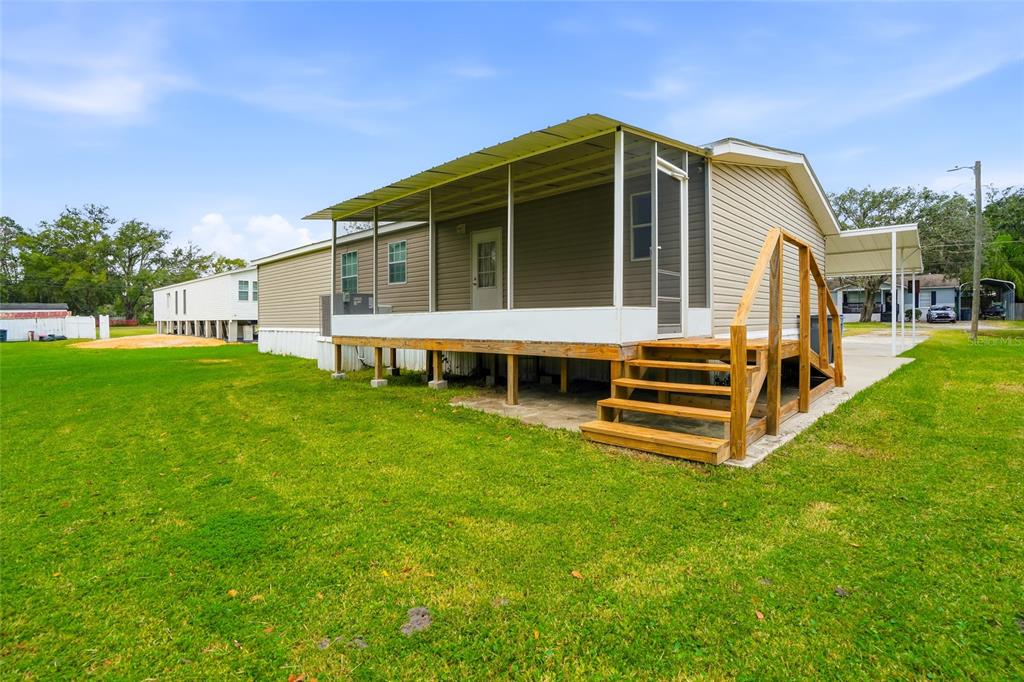 11305 Broadview Road Seffner, FL 33584 - Photo 26 of 34 a view of a house with a backyard