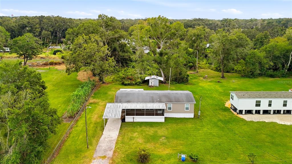 11305 Broadview Road Seffner, FL 33584 - Photo 30 of 34 a swimming pool with some trees in the background