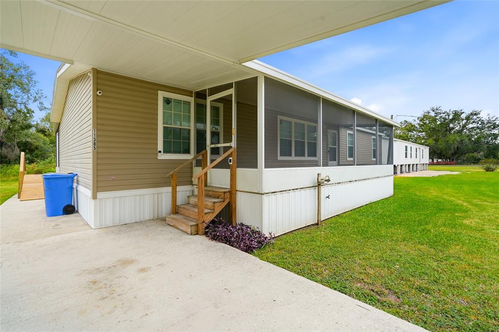 11305 Broadview Road Seffner, FL 33584 - Photo 7 of 34 a view of a house with backyard and porch