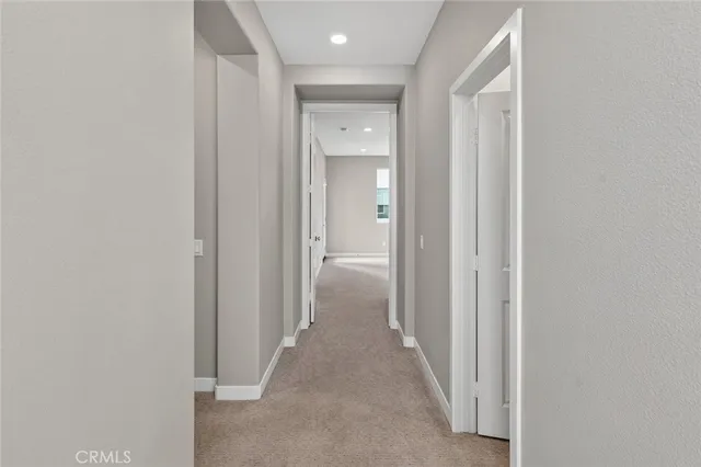 a view of a hallway with a wooden walls