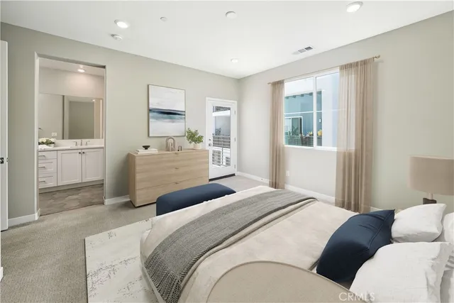 a bedroom with a bed and a couch