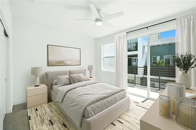 a bedroom with a large bed and a window