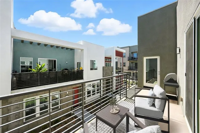 a view of terrace with seating area and furniture