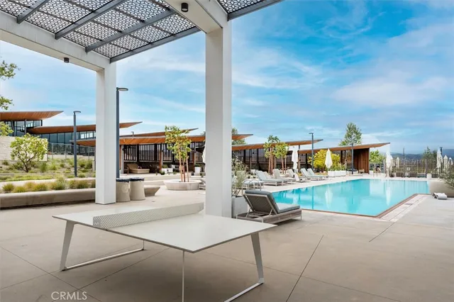 a view of a kitchen with kitchen island a large window in it