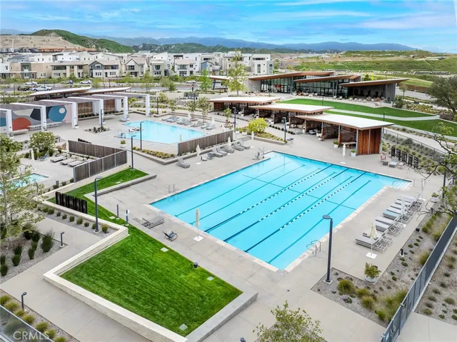 an aerial view of a house with a swimming pool