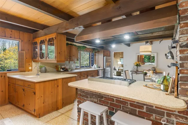 a kitchen with a sink and wooden cabinets