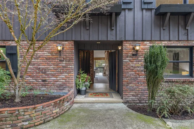 a view of a house with potted plants