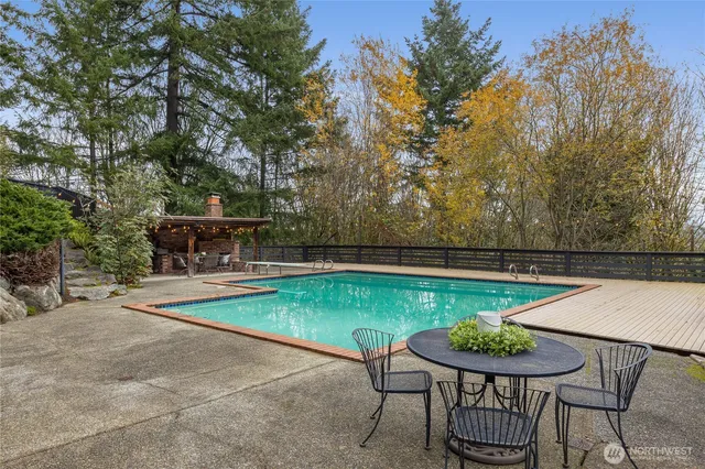 a view of a chairs and table on the patio