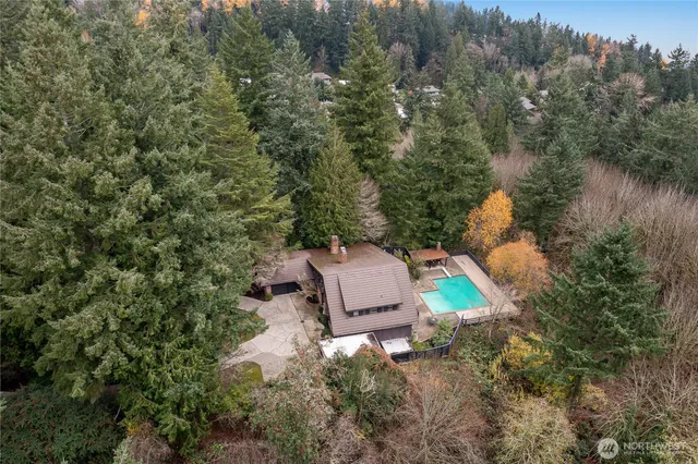 an aerial view of a house with outdoor space