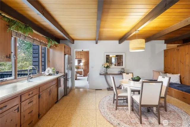 a view of a dining room with furniture and window